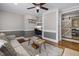 Living room with built-in workspace and hardwood floors at 909 E F St, Butner, NC 27509