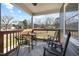 Covered porch with rocking chairs and a small table at 909 E F St, Butner, NC 27509