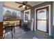 Front porch with rocking chairs and a welcome sign at 909 E F St, Butner, NC 27509