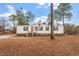 Single-story home with red front door and landscaped yard at 97 Brent Wood Ct, Sanford, NC 27332