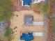 New home with driveway and landscaped yard; aerial view at 101 Prairie Dog Dr, Louisburg, NC 27549