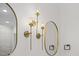 Gold light fixtures above a modern bathroom vanity at 101 Prairie Dog Dr, Louisburg, NC 27549