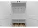 Spacious coat closet with built-in shelves and bench at 101 Prairie Dog Dr, Louisburg, NC 27549