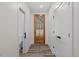 Bright hallway with wood-look flooring and access to other rooms at 101 Prairie Dog Dr, Louisburg, NC 27549