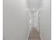 Light and airy hallway with wood-look floors at 101 Prairie Dog Dr, Louisburg, NC 27549