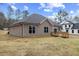 Ranch-style home with gray siding and a wooden deck at 101 Prairie Dog Dr, Louisburg, NC 27549