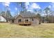 Gray siding house, wooden deck, and large backyard at 101 Prairie Dog Dr, Louisburg, NC 27549