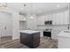 Modern kitchen with island and white shaker cabinets at 101 Prairie Dog Dr, Louisburg, NC 27549