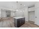 Kitchen island, view of living room and fireplace at 101 Prairie Dog Dr, Louisburg, NC 27549