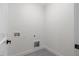 Bright laundry room with washer and dryer hookups at 101 Prairie Dog Dr, Louisburg, NC 27549