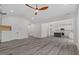 Open living room with hardwood floors and kitchen view at 101 Prairie Dog Dr, Louisburg, NC 27549