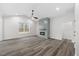 Living room with vaulted ceiling, fireplace, and wood-look floors at 101 Prairie Dog Dr, Louisburg, NC 27549