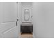 Modern powder room with dark vanity and gold fixtures at 101 Prairie Dog Dr, Louisburg, NC 27549