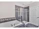 Modern bathroom with a large shower and a soaking tub at 10400 Rosegate Ct # 303, Raleigh, NC 27617