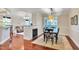 Open concept dining room with hardwood floors and fireplace at 10400 Rosegate Ct # 303, Raleigh, NC 27617