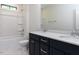 Bathroom featuring dual vanity with white countertops and dark blue cabinets at 108 Bearwallow Forest Way, Wendell, NC 27591