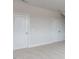 Neutral bedroom showcasing two white doors and neutral carpet at 108 Bearwallow Forest Way, Wendell, NC 27591