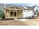Charming exterior featuring a screened porch, concrete patio and landscaped yard at 108 Bearwallow Forest Way, Wendell, NC 27591