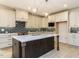 Elegant kitchen featuring a large island, modern appliances, and stylish pendant lighting at 108 Bearwallow Forest Way, Wendell, NC 27591