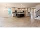 Open concept kitchen with island, white cabinets, and stainless steel appliances at 108 Bearwallow Forest Way, Wendell, NC 27591