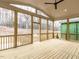 Expansive screened porch with ceiling fan, wood floors and frame, perfect for enjoying the outdoors at 108 Bearwallow Forest Way, Wendell, NC 27591