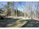 Large backyard with a wooden deck and privacy fence at 109 Springwood Dr, Wake Forest, NC 27587