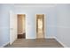 Light blue bedroom with wood floors and access to bath at 109 Springwood Dr, Wake Forest, NC 27587