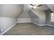 Large bonus room featuring a ceiling fan and window at 109 Springwood Dr, Wake Forest, NC 27587