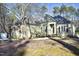 House exterior and yard with trees and a shed at 109 Springwood Dr, Wake Forest, NC 27587
