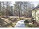 Walkway to home with fountain, offering curb appeal at 109 Springwood Dr, Wake Forest, NC 27587