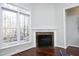 Gathering room featuring a corner fireplace and hardwood floors at 109 Springwood Dr, Wake Forest, NC 27587
