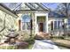 Green house exterior with a fountain, landscaping, and a walkway at 109 Springwood Dr, Wake Forest, NC 27587