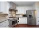 Kitchen boasts stainless steel appliances and granite countertops at 109 Springwood Dr, Wake Forest, NC 27587