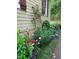 Landscaped flower garden with roses and irises next to the home at 109 Springwood Dr, Wake Forest, NC 27587
