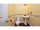 Convenient powder room with pedestal sink and toilet at 109 Springwood Dr, Wake Forest, NC 27587