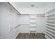 Walk-in closet with custom shelving and ample storage space at 109 Springwood Dr, Wake Forest, NC 27587