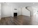 Living room featuring hardwood floors and a gas fireplace at 1226 Barn Cat Way, Apex, NC 27502