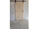 Bedroom with a stylish barn door at 1235 Stone Manor Dr, Raleigh, NC 27610