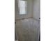 Well-lit bedroom with carpeted floors and window at 1235 Stone Manor Dr, Raleigh, NC 27610