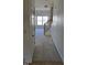 Inviting entryway with carpeted floors and views into the living room and staircase at 1235 Stone Manor Dr, Raleigh, NC 27610