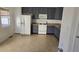 Kitchen features dark gray cabinets and white appliances at 1235 Stone Manor Dr, Raleigh, NC 27610