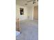 Spacious living room with neutral carpeting and a view into the kitchen at 1235 Stone Manor Dr, Raleigh, NC 27610