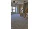 Spacious living room with large windows and carpeted floor at 1235 Stone Manor Dr, Raleigh, NC 27610