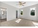 Spacious bedroom featuring carpet flooring and large windows at 1240 Dover St # 57, Roxboro, NC 27573