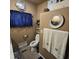 Cozy bathroom with brown walls, blue accents, and thoughtful decor for a relaxing feel at 1309 Eastern Avenue Ave, Rocky Mount, NC 27801