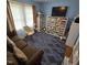 Cozy bedroom with blue walls, nice carpet and a comfortable couch at 1309 Eastern Avenue Ave, Rocky Mount, NC 27801