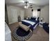 Comfortable bedroom features neutral walls and a navy blue accent for a relaxing atmosphere at 1309 Eastern Avenue Ave, Rocky Mount, NC 27801