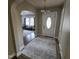 Inviting entryway featuring arched doorways, a neutral rug, and a view into the living space at 1309 Eastern Avenue Ave, Rocky Mount, NC 27801
