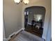 Entryway featuring arched doorways, stylish decor, a neutral rug, and seamless transition to other living areas at 1309 Eastern Avenue Ave, Rocky Mount, NC 27801