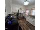 Functional kitchen with white cabinets, stainless steel appliances, granite countertops, and wood-look flooring at 1309 Eastern Avenue Ave, Rocky Mount, NC 27801